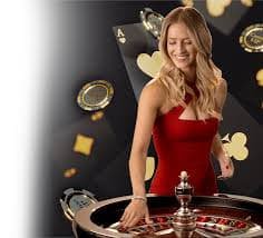 Live Dragon Tiger table with dealer revealing cards